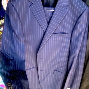Men’s Designer Suits. Luxury hand tailored from Iconic Rockys Custom Suits.
